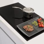 An Electric Cooktop With a Built-In Extractor Is a Great Space Saver
