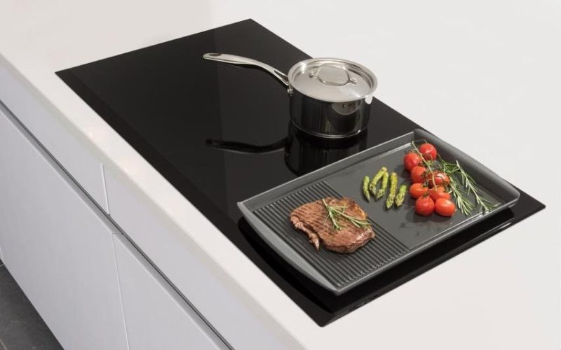 An Electric Cooktop With a Built-In Extractor Is a Great Space Saver